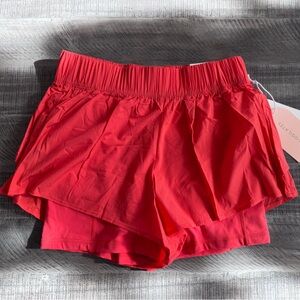 Blogilates Ruffle Short- Spicy Orange, size XS